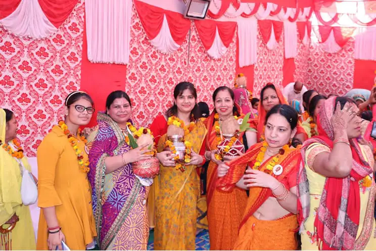 Female Hindu wedding guests getting ready for wedding ceremony